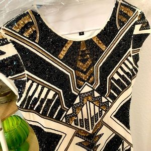 Sequin form fitting dress.